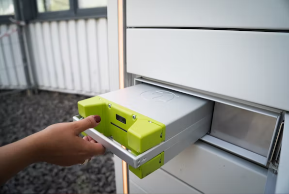 a hand holding a lithium-ion battery